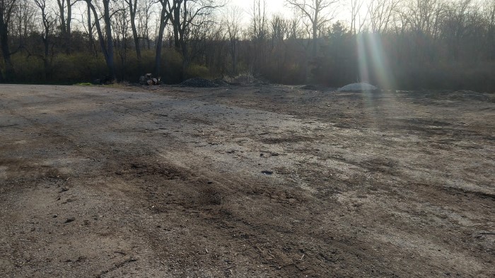 A photo facing away from the piles of debris showing what the Huber Heights Yard Waste Site looks like